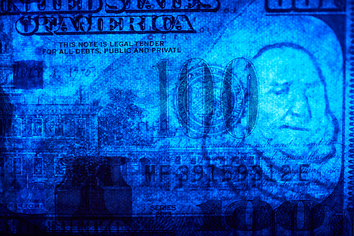 depth, colorful light close-up $100 US dollar banknote