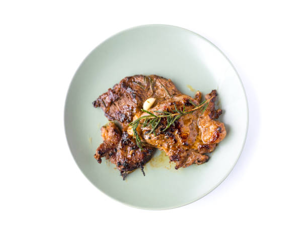 istock grilled beef steak and rosemary isolated on white background 1441292712