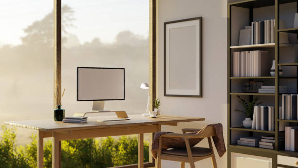 istock Minimal and comfortable home office workspace with computer mockup on wood table 1441297889