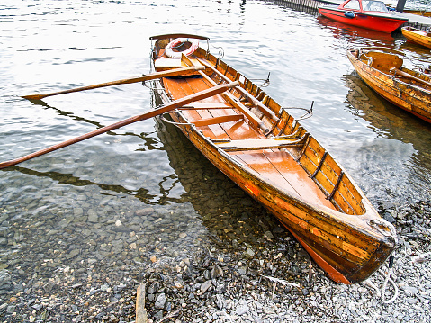 Boats on shore of Lake Winderness Lake District National Park,