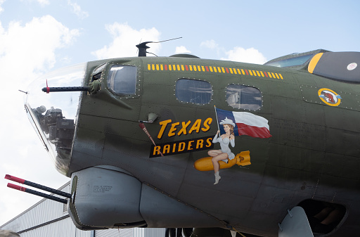 B17 Flying Fortress with Texas Raiders painted on its nose cone. The vintage World War II aircraft was part of the Commemorative Air Force fleet in Conroe, Texas. Photographed at the Houston Airshow earlier in 2022.