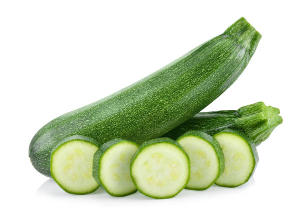 fresh green zucchini with slice isolated on white background fresh green zucchini with slice isolated on white background.. Full depth of field Whole Cucumber stock pictures, royalty-free photos & images