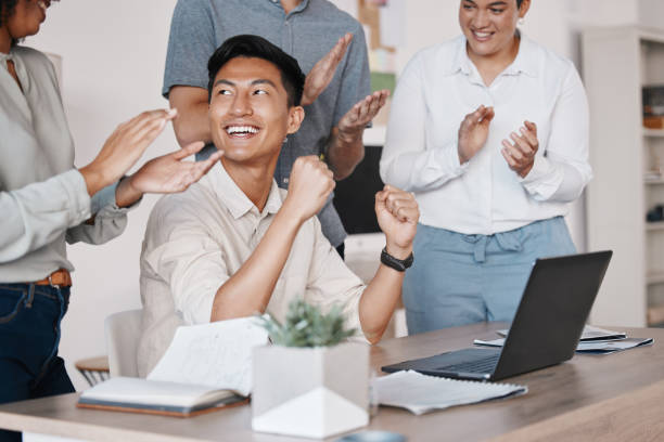 istock Teamwork, applause and motivation for success or celebration at SEO, online tech or UX startup agency office. Creative corporate Asian businessman celebrate win in internet website design target goal 1441303703