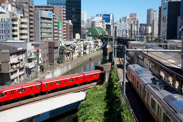 Tokyo, japan - November 08,2020 : Many trains run into Ochanomizu Station. Akihabara can be seen in the background.