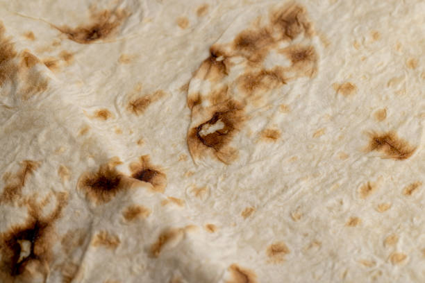 istock Wheat pita bread with dark spots 1441307685