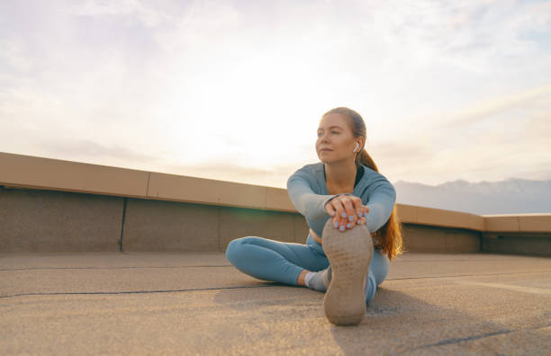 istock Young sportswoman is warming up 1441315613