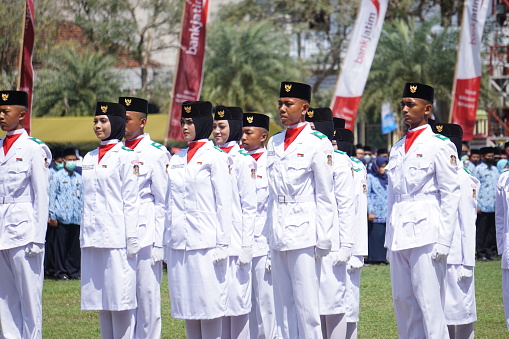 Blitar, East Java, Indonesia - August 17th, 2022 : Indonesian flag raiser (paskibraka) in independence day ceremony