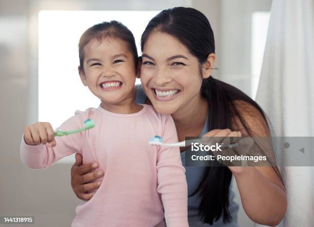 Portrait Of Mom And Kid Brushing Teeth Dental Healthy And Cleaning In Bathroom At Home Happy Mother And Girl Learning Oral Healthcare Wellness And Fresh Breath For Toothbrush Toothpaste And Smile Stock Photo - Download Image Now