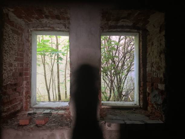 istock Dark room window of abandoned house 1441319540