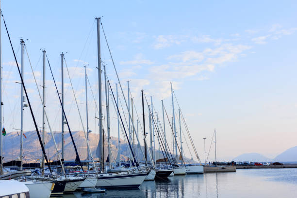 istock Dawn at the sea. Pier with yachts and benches 1441320437
