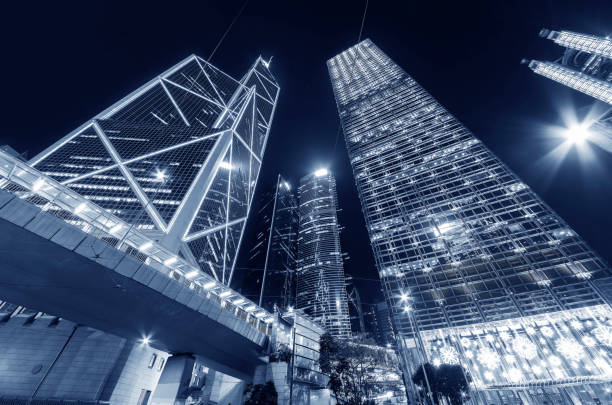 Skyscraper in downtown district of Hong Kong city at night stock photo