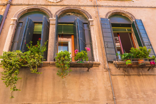 istock Window in an old house decorated with flower 1441323011