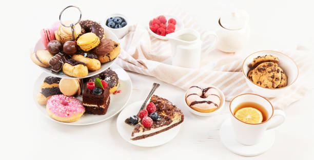 istock Afternoon tea stand with sweet treats. 1441323080