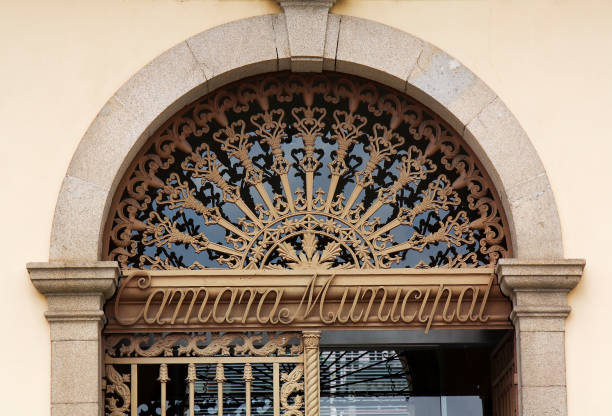 istock Ancient cast iron railing covering fan window over front door. 1441325686