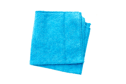 Folded blue rag for housework with soft texture isolated on white, top view