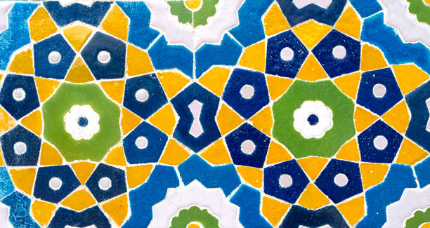 istock Vintage oriental colored tiles on the wall. Old geometric pattern as building decoration 1441329432