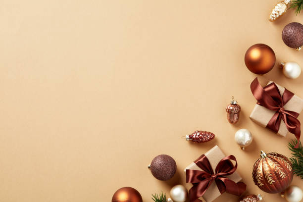 istock Christmas flat lay composition. Frame made of vintage Christmas decorations, gift boxes, baubles, fir branches on beige background. Happy New Year greeting card template. 1441331581