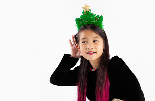 Asian student cute girl in black sweater posing gossip and listening white background.