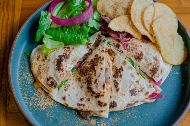 istock Quesadilla with addition vegetable, onion and some potato crisp 1441336665