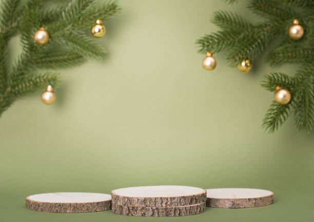 istock Three wooden platforms or podiums with copy-space for products presentation over green Christmas background. 1441337841
