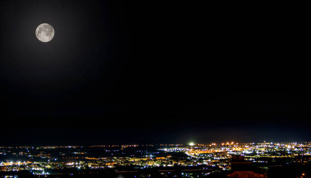 istock Lanscape night city with moon 1441338910