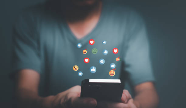 istock Man using Smartphone chatting with social media icons. 1441340069