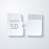 istock Micro SD card - Front and back view. Icon with paper cut effect on blank background 1441343281