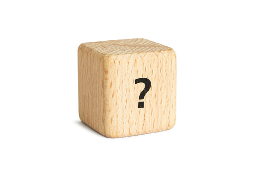 Wooden cube with question mark isolated on white background
