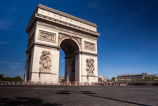 View of the Arc de Triomphe, a landmark monument on Place de l'Etoile and the Champs-Elysees in Paris, France.