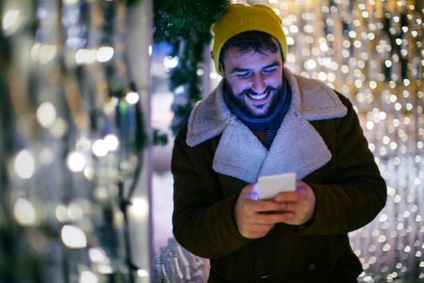 istock Young man online shopping during Christmas time. 1441344701