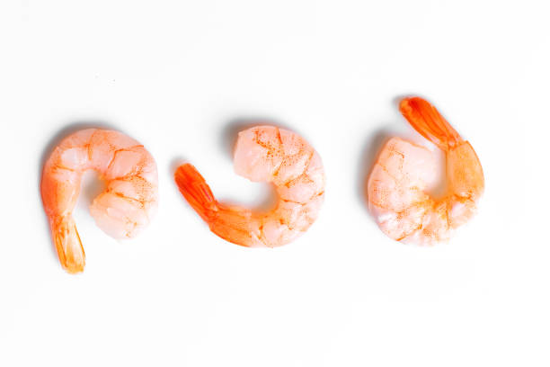 istock Peeled Shrimps on white background 1441345467