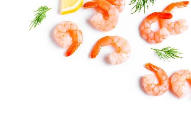 istock Shrimps with lemon and dill isolated on white background 1441345517