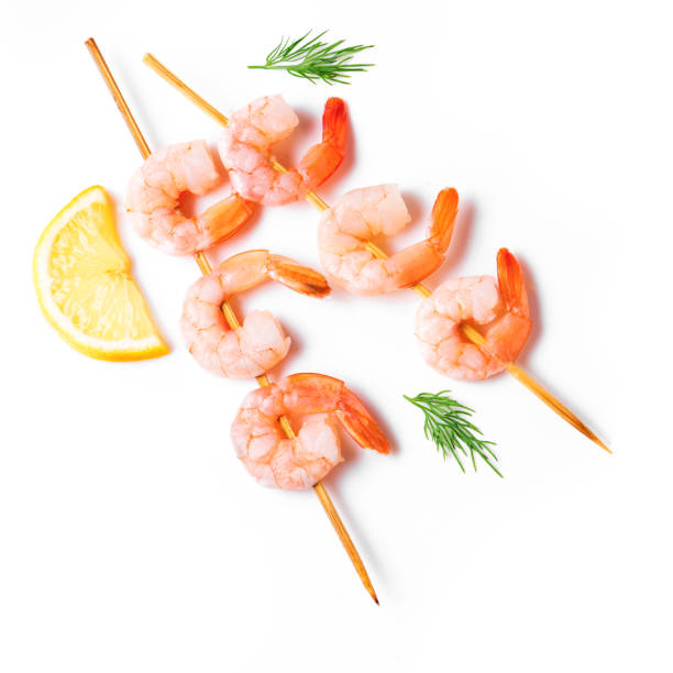 istock Shrimp skewers isolated on white background 1441345540