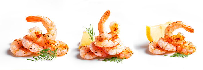 Grilled or Roasted Shrimps set isolated on white background. Fried spicy prawn seafood close up with dill and lemon, design element.