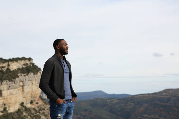 istock Black man contemplating nature in the mountain 1441346802