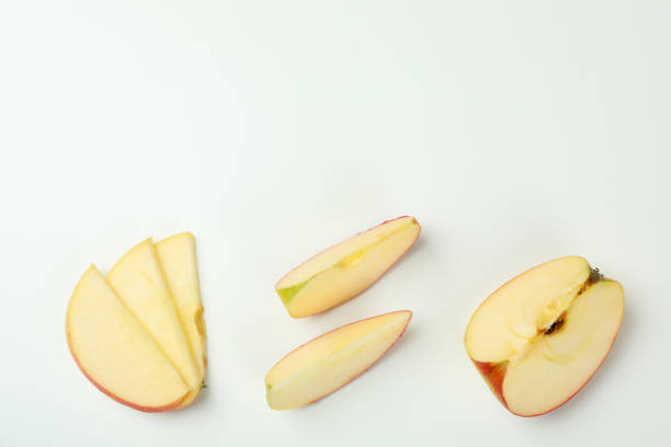 istock Ripe apple slices on white background, top view 1441347001