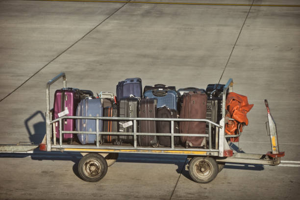 istock Luggages Waiting To Be Loaded Onto The Plane 1441347155