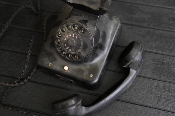 Obsolete and decaying old British red telephone box now surplus to requirements with the advent of mobile phone technology