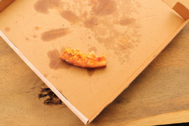 istock a pizza box with another slice of pizza 1441348648