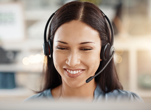 Contact us, telemarketing and crm, a woman in customer service with headset and a smile on her face. Happy to help, call center agent or sales consultant on phone call, support and consulting online