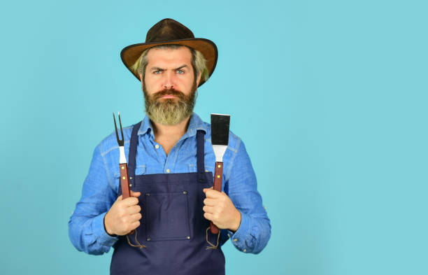 istock Cooking steak. Cooking utensils. Summer picnic. Bbq american tradition. Culinary concept. Medium rare. Bbq food. Tools roasting meat. Man in apron hold barbecue grill. Farmer promoting bbq equipment 1441351697