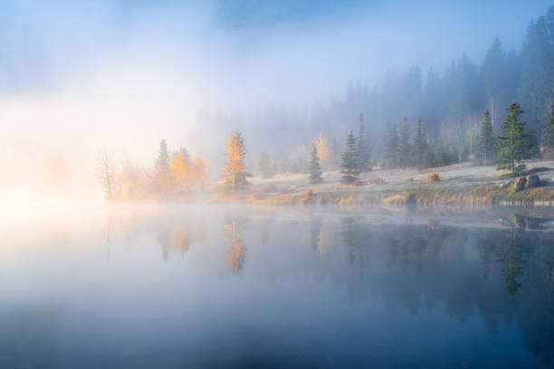 istock Fall. Landscape during sunrise. Autumn trees on the river bank. Mountains and forest. Reflections on the surface of the lake. Vivid colours during dawn. Banff National Park, Alberta, Canada. 1441351930