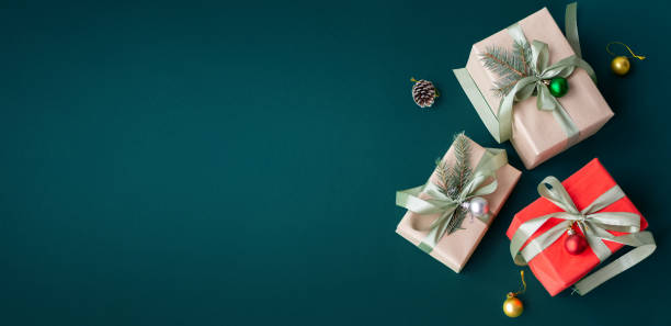 istock Banner with many gift boxes with paper decorations on turquoise background. Christmas background. 1441353046