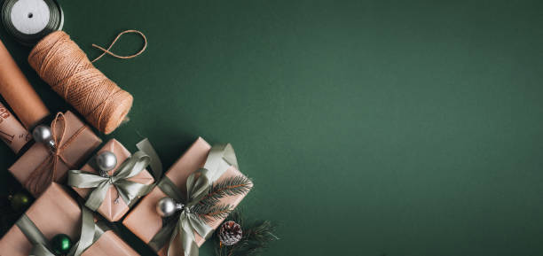 istock New Year banner with Christmas gift boxes and decorations on khaki background. 1441353122