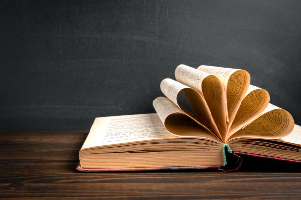 istock Study, learning, library or bookstore concept. Book on a wooden background 1441354036