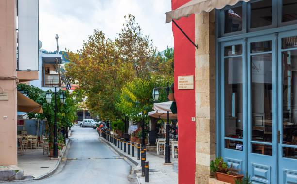 Central square of Archanes Archanes Heraklion, October 30 2022- Central square of Archanes with plenty of restaurants traditional coffee shops  and neoclassical buildings. arhanes stock pictures, royalty-free photos & images