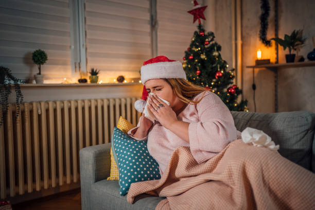 istock Woman being sick at home for Christmas 1441355061