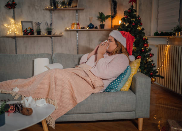 istock Woman being sick at home for Christmas 1441355089