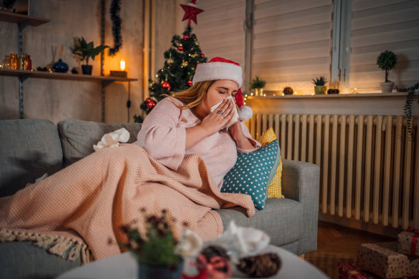 istock Woman being sick at home for Christmas 1441355139
