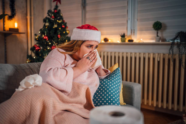istock Woman being sick at home for Christmas 1441355175